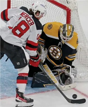  ?? MATT STONE / hErAld STAff filE; lEfT, STuArT CAhill / hErAld STAff filE ?? LEAVING AN ULL-MARK: Linus Ullmark makes a stop on Dawson Mercer of the New Jersey Devils at TD Garden on March 31. Left, Jeremy Swayman handles a 2-on-0 breakaway against the Toronto Maple Leafs on March 29.