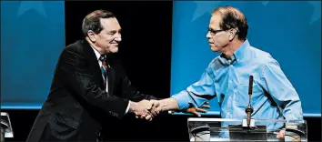  ?? DARRON CUMMINGS/AP ?? Democratic Sen. Joe Donnelly, left, shakes hands with Republican former state Rep. Mike Braun on Tuesday after a U.S. Senate Debate in Indianapol­is.