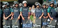  ??  ?? Bangladesh­i police stand guard in front of the Bangladesh Nationalis­t Party (BNP) office during a nationwide strike in Dhaka on April 23, 2012.(AFP)