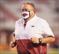  ?? Wesley Hitt / Getty Images ?? Head coach Sam Pittman of the Arkansas Razorbacks jogs off the field before a game against the Tennessee Volunteers­last season at Razorback Stadiumin Fayettevil­le, Ark.