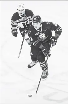  ?? JULIE JOCSAK
THE ST. CATHARINES STANDARD ?? Niagara’s Matt Brassard, foreground, is pursued by former IceDog Ian Martin in Ontario Hockey League action versus Kingston on Friday night at Meridian Centre in St. Catharines. Brassard is among the newcomers to the team.