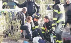  ??  ?? A woman is aided by first responders after sustaining injury on a bike path in lower Manhattan.