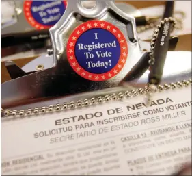  ?? ISAAC BREKKEN / AP FILE ?? A Spanish version of a Nevada voter registrati­on form is seen in Las Vegas. Latino voters made up 14 percent of the electorate in this year’s midterms, according to an Associated Press study.