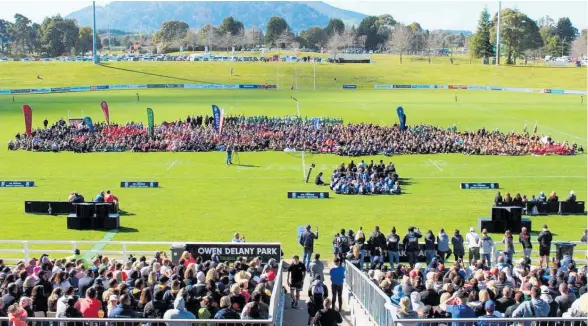  ?? ?? Teams and supporters gather at Taupō ‘s Owen Delany Park for the Global Games Junior Rugby Festival in 2019.