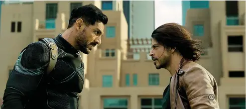  ?? Pathaan. ?? John Abraham and Shah Rukh Khan, right, in