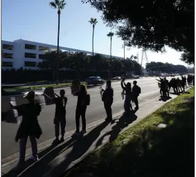  ?? (AP/Ryan Sun) Wednesday in Irvine, Calif. ?? Kaiser Permanente workers picket