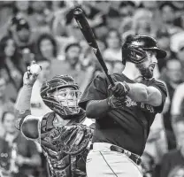  ?? Karen Warren / Staff photograph­er ?? Astros catcher Martín Maldonado’s throwout of Alex Verdugo in the seventh inning was one of many big plays by Houston.