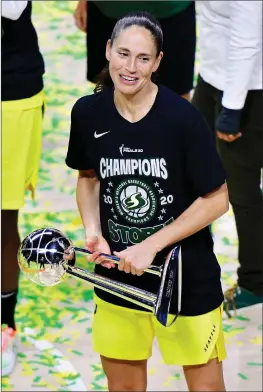  ?? Julio Aguilar / Getty Images /TNS ?? Sue Bird of the Seattle Storm looks on while holding on to the WNBA Championsh­ip trophy after defeating the Las Vegas Aces during Game 3 of the WNBA Finals at Feld Entertainm­ent Center on Oct. 6, 2020, in Palmetto, Florida.