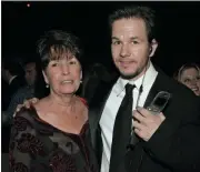  ?? LISA ROSE — ASSOCIATED PRESS ?? In this Sunday, Jan. 16, 2005, file photo, Mark Wahlberg, executive producer of the HBO series “Entourage,” and his mother Alma pose at the HBO party after the 62nd Annual Golden Globe Awards, in Beverly Hills, Calif.