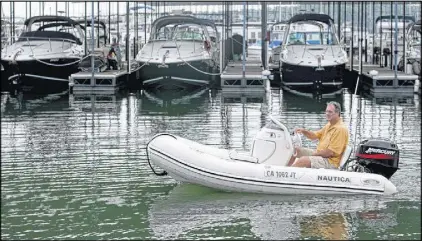  ??  ?? For a $125 fee, Jeff Perfater, of SafeNav Captain Services, will hop aboard his 10-foot inflatable Zodiac and rendezvous with any impaired boater on Lake Lanier. Once aboard, Perfater, a Coast Guard certified master captain, will pilot the vessel back...