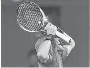  ?? Lintao Zhang / Getty Images ?? Novak Djokovic rips his shirt after losing a point in a semifinal loss to Roberto Bautista Agut at the Shanghai Masters on Saturday in China.