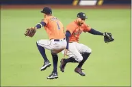  ?? Ezra Shaw / TNS ?? From left, the Astros’ Carlos Correa and George Springer celebrate their win over the Rays in Game 6 of the ALCS on Oct. 16.