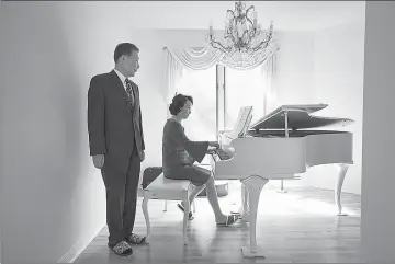  ?? Jessica Griffin/Philadelph­ia Inquirer/TNS ?? Young Bin Lee, a neuropsych­iatrist, stays young by trying to think like a younger person. He is shown here listening as his wife, Euli, play the piano Aug. 6 in their Medford, N.J., home.