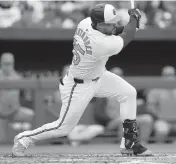  ?? MITCH STRINGER USA TODAY NETWORK ?? Orioles outfielder Anthony Santander hits a sacrifice fly during the second inning Thursday as Baltimore opened its season against the Angels with an 11-3 victory.