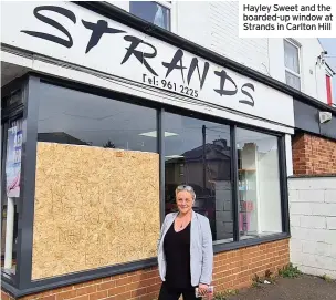  ??  ?? Hayley Sweet and the boarded-up window at Strands in Carlton Hill