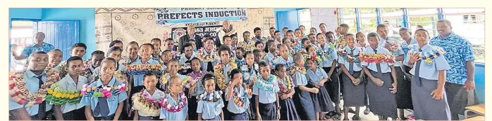  ?? Picture: ANA MADIGIBULI ?? Public Works, Meteorolog­ical Services and Transport Minister, Ro Filipe Tuisawau (centre standing) was chief guest at the Tacirua Primary School and Jeremiah Raibevu College prefect induction ceremonies this month.