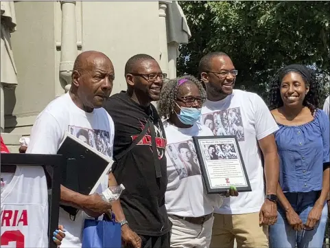  ?? KEVIN MARTIN — THE MORNING JOURNAL ?? Ike Maxwell, left, was honored on Aug. 28in a ceremony at Ely Square for his contributi­ons as a running back for the Elyria Pioneers football team on “Ike Maxwell Appreciati­on Day.”