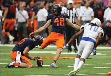  ?? Photo courtesy of Syracuse Athletics ?? Syracuse kicker and Valenica alum Cole Murphy goes for a kick against Central Connecticu­t State University. Murphy is currently the No. 1 kicker in the ACC with 12 field goals made on 14 attempts.