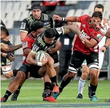  ??  ?? Hurricanes wing Ben Lam attempts to break through the Crusaders' defence in Christchur­ch last weekend.