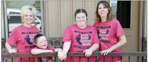  ?? STACI VANDAGRIFF/RIVER VALLEY & OZARK EDITION ?? Randi Newland, from left, and her son Weston, 8, stand with friends Sammy McJunkins, 20, and her mother, Darla. The two mothers of children with Down syndrome founded a nonprofit and organized the Clinton Down Syndrome Walk, formerly called the Buddy Walk. The eighth-annual walk is scheduled for 9 a.m. to noon Sept. 7 at the Clinton High School gym.