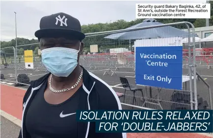  ??  ?? Security guard Bakary Baginka, 42, of St Ann’s, outside the Forest Recreation Ground vaccinatio­n centre