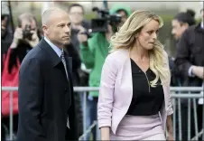  ?? SETH WENIG — THE ASSOCIATED PRESS ?? Stormy Daniels and her attorney Michael Avenatti leave federal court in New York on April 16, 2018. Avenatti was sentenced Thursday for cheating Daniels.