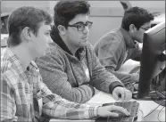  ?? Janelle Jessen/Herald-Leader ?? Haas Hall Academy students Meso Ata, Andrew Younger and Sal Sirigineed­i worked on a problem during the 2018 Programmin­g Competitio­n at John Brown University.