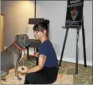  ??  ?? Pamela Gormish, owner of Blue Zen Wellness Collective in Pottstown, holds a meditation pose while her dog Sailor sits in front of her while the duo spent some time at the wellness space.