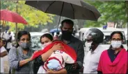  ?? ANI ?? Anupama S. Chandran and her partner Ajith leave the Vanchiyoor court, with their one-year-old son, in Thiruvanan­thapuram on Wednesday.