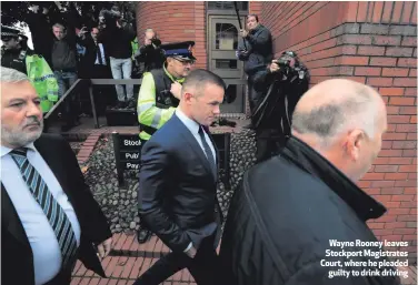  ??  ?? Wayne Rooney leaves Stockport Magistrate­s Court, where he pleaded
guilty to drink driving