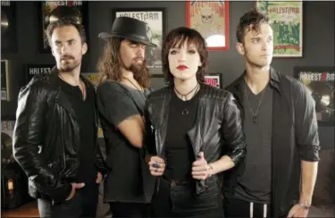  ?? MARK HUMPHREY — THE ASSOCIATED PRESS ?? In this July 20, 2018, photo, members of Halestorm, from left, Josh Smith, Joe Hottinger, Lzzy Hale, and Arejay Hale pose in Nashville, Tenn., to promote their new record, “Vicious.”