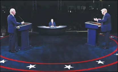  ??  ?? ترامب وبايدن خلال المناظرة التي جرت بينهما الثلاثاء