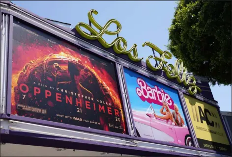  ?? CHRIS PIZZELLO — AP ?? The marquee for the Los Feliz Theatre features the films “Oppenheime­r” and “Barbie,” on July 28, in Los Angeles.