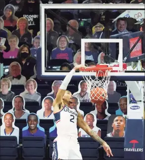  ?? David Butler II / Associated Press ?? UConn’s James Bouknight dunks against DePaul on Wednesday in Storrs.