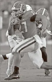  ?? Joshua L. Jones / Athens Banner-Herald via AP ?? Georgia tailback Nick Chubb (27) rushes for 151 yards Saturday to push him past 1,000 yards for the third time — joining Herschel Walker for the UGA record.