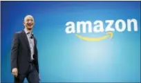  ?? FILE PHOTO - ASSOCIATED PRESS ?? Amazon CEO Jeff Bezos walks on stage June 16, 2014, for the launch of the new Amazon Fire Phone, in Seattle. Amazon is looking for a place to put a second headquarte­rs operation.