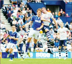  ??  ?? LEAP: Preston’s Paul Huntington battles with Christophe Berra