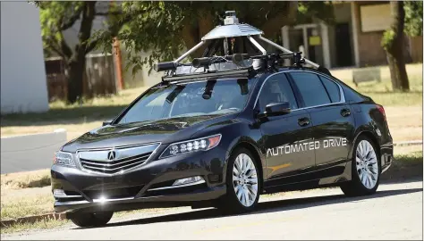  ?? REUTERS ?? An autonomous version of Acura’s RLX Sport Hybrid SH- AWD drives at carmaker Honda’s testing grounds at the GoMentum Station autonomous vehicle test facility in Concord, California on Wednesday.