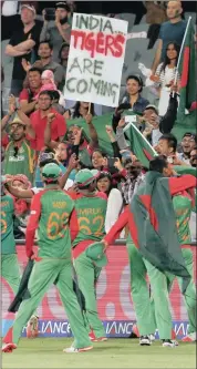  ?? Picture: REUTERS ?? WE LOVE YOU TIGERS: The Bangladesh fans salute their heroes in Adelaide yesterday.