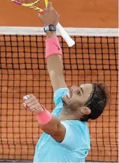  ?? AP Photo/Alessandra Tarantino ?? Spain's Rafael Nadal celebrates winning his quarterfin­al match of the French Open tennis tournament Wednesday against Italy's Jannik Sinner in three sets, 7-6 (7-4), 6-4, 6-1, at the Roland Garros stadium in Paris, France.