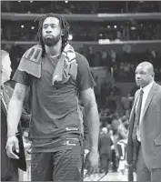  ?? Michael Owen Baker Associated Press ?? AFTER SATURDAY’S loss, the Clippers’ DeAndre Jordan walks off the court ahead of coach Doc Rivers.