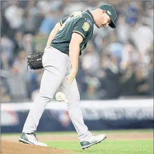  ?? JANE TYSKA — STAFF PHOTOGRAPH­ER ?? Oakland A’s pitcher Liam Hendriks gives up a two-run home run to New York Yankees’ Aaron Judge in the first inning of their wild-card game on Wednesday.