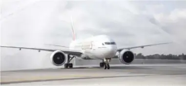  ??  ?? A traditiona­l water cannon salute welcomes Emirates Airline Inaugural Flight EK213 at Fort Lauderdale-Hollywood Internatio­nal Airport