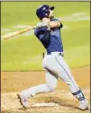  ??  ?? Tampa Bay Rays’ Brandon Lowe follows through on a two-run home run during the eighth inning of a baseball game against the New York Mets on
Sept 23, in New York. (AP)