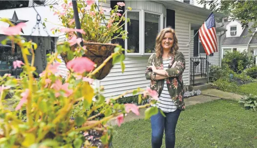  ?? ROBERT DEUTSCH, USA TODAY ?? MeaganWals­h, 25, bought this house in Allentown, Pa., after moving back into her parents’ house after college. During her two- year stay, she was able to bank 75% to 80% of her paycheck after paying $ 250 each month toward her student loans.
