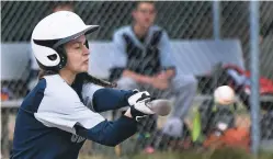  ?? CLYDE MUELLER/THE NEW MEXICAN ?? Santa Fe Prep’s Kate Schiliro gets a hit during Tuesday’s game against Monte del Sol at the Municipal Recreation Complex. For more photos, go to smu.gs/ 2o4CiU8.