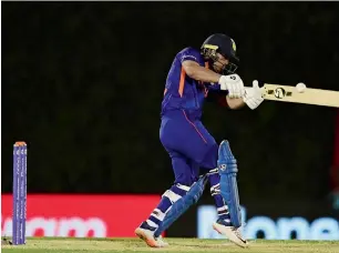  ?? ?? Indian batsman Ishan Kishan plays a shot during the warm-up match against England in Dubai on Monday. — AFP