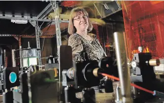  ?? PETER LEE WATERLOO REGION RECORD ?? University of Waterloo Physics Professor Donna Strickland inside her laser lab at UW. She is half of the team that discovered Chirped Pulse Amplificat­ion, a technique that underpins short-pulse, high-intensity lasers.