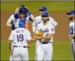  ?? THE ASSOCIATED PRESS ?? New York Mets relief pitcher Chasen Shreve (47) hands the ball to manager Luis Rojas (19) as he leaves the game during the eighth inning of a game against the Tampa Bay Rays.