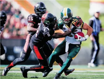  ?? JEFF MCINTOSH/ THE CANADIAN PRESS/ FILE ?? The Edmonton Eskimos need to beat the Calgary Stampeders in this year’s Labour Day match if they want to be considered true Grey Cup contenders, Jason Gregor writes.
